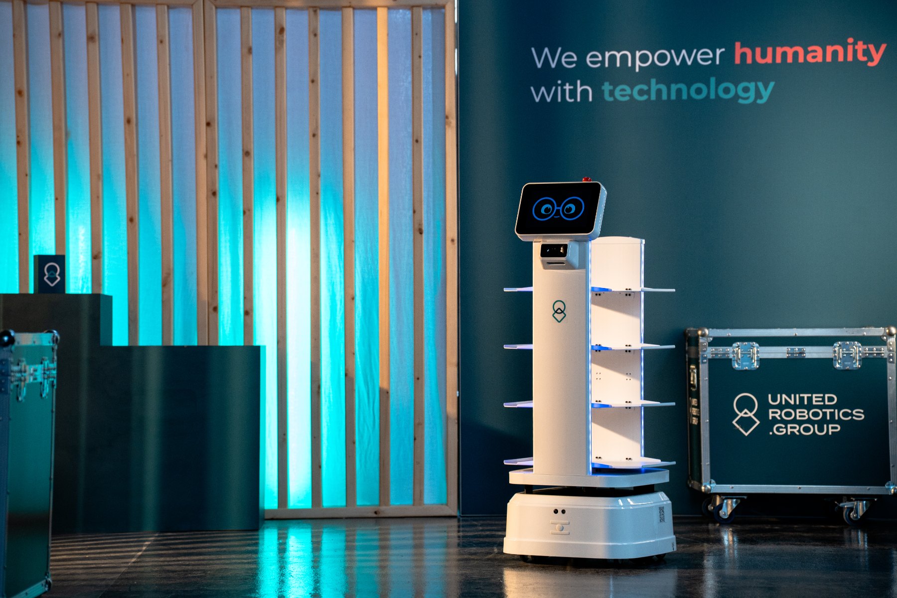 uLog Deliver, autonomous mobile robot for material transport, shown with transport case.