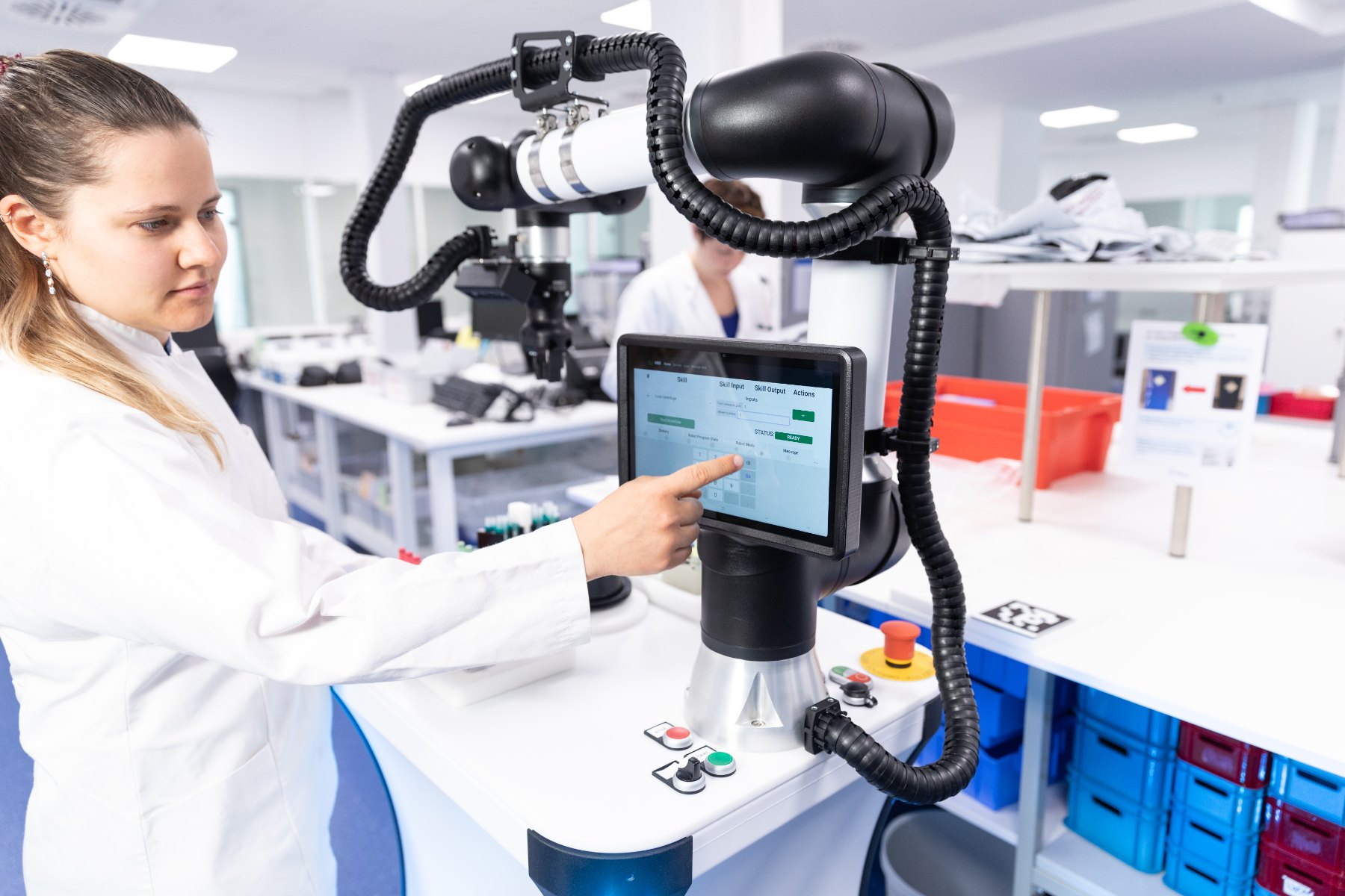 uLab Mobile in laboratory operation: a laboratory employee operates the robot via the touch display.